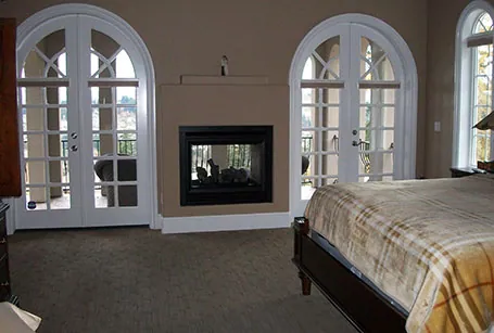 Dining room with arched windows and a chandelier