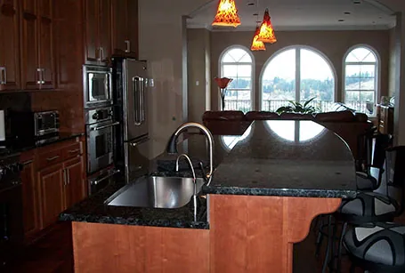 Kitchen with granite counters and arched windows