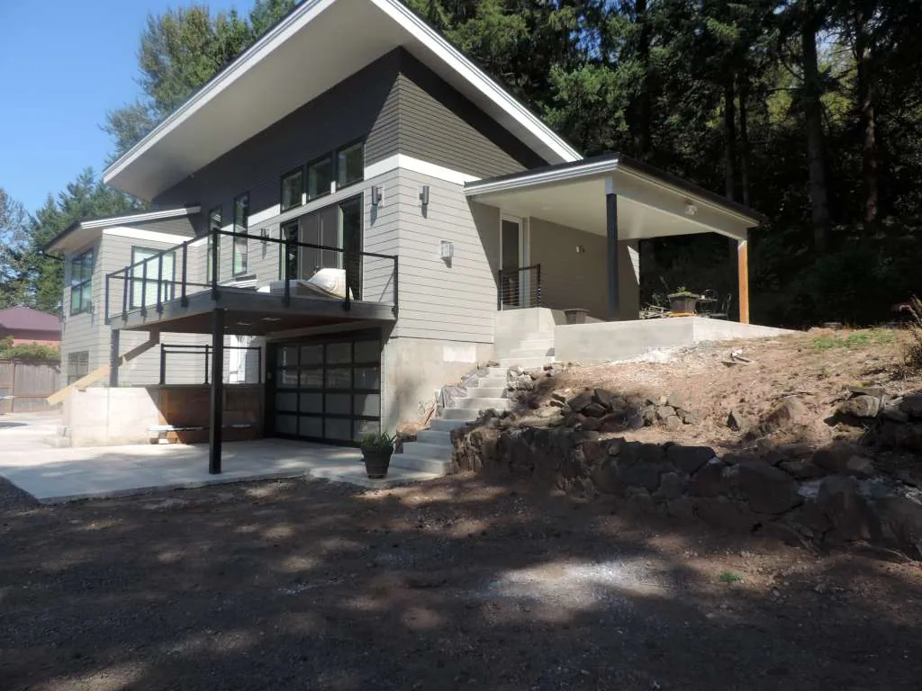 Shed-roof contemporary home on a sloped hillside lot