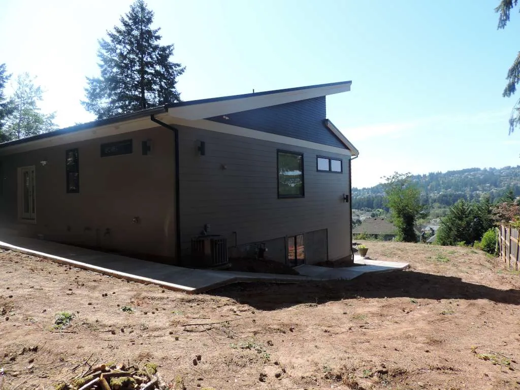 Contemporary home set into a sloping lot with a view