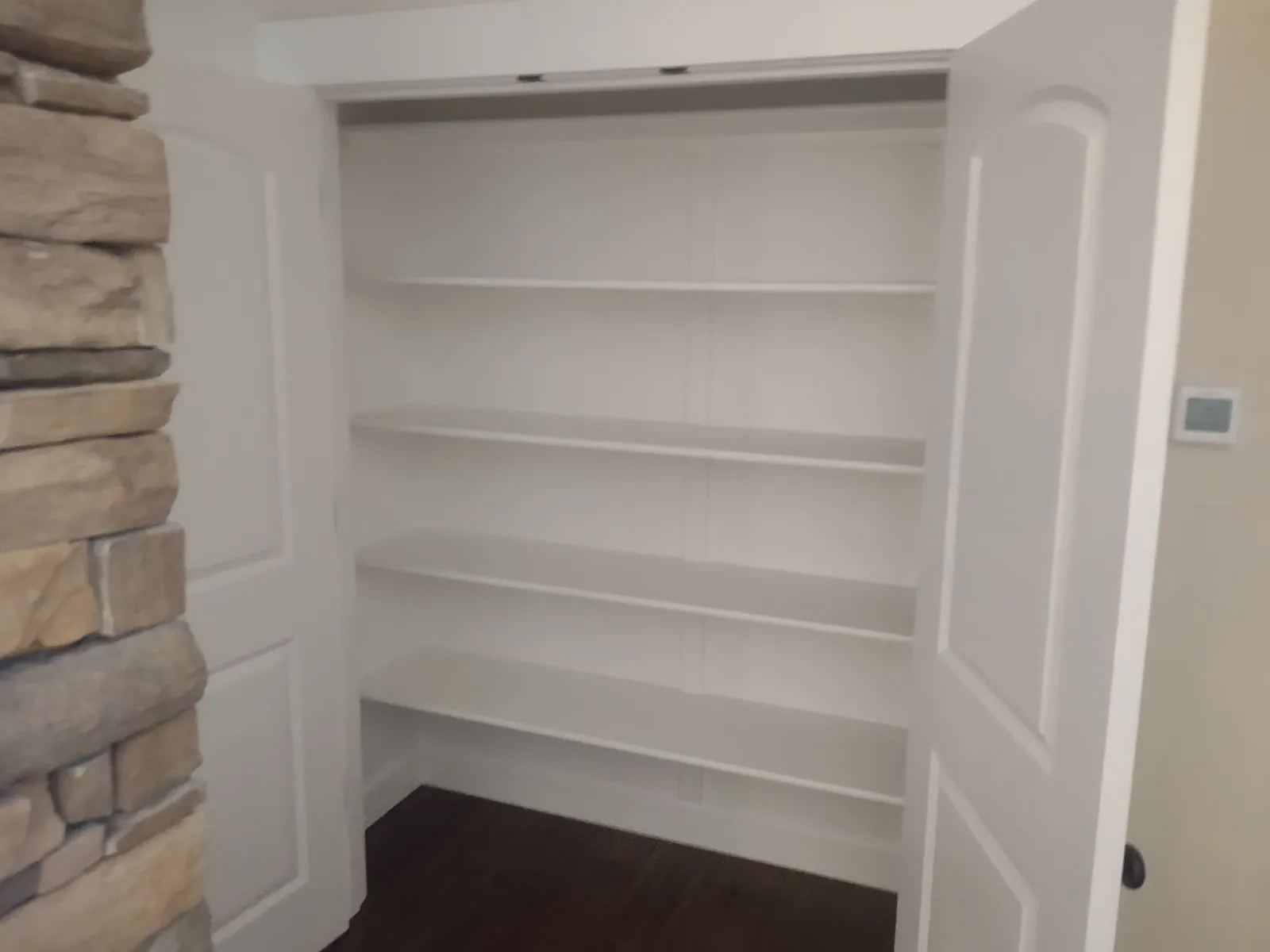 Closet with enamel-finished shelves