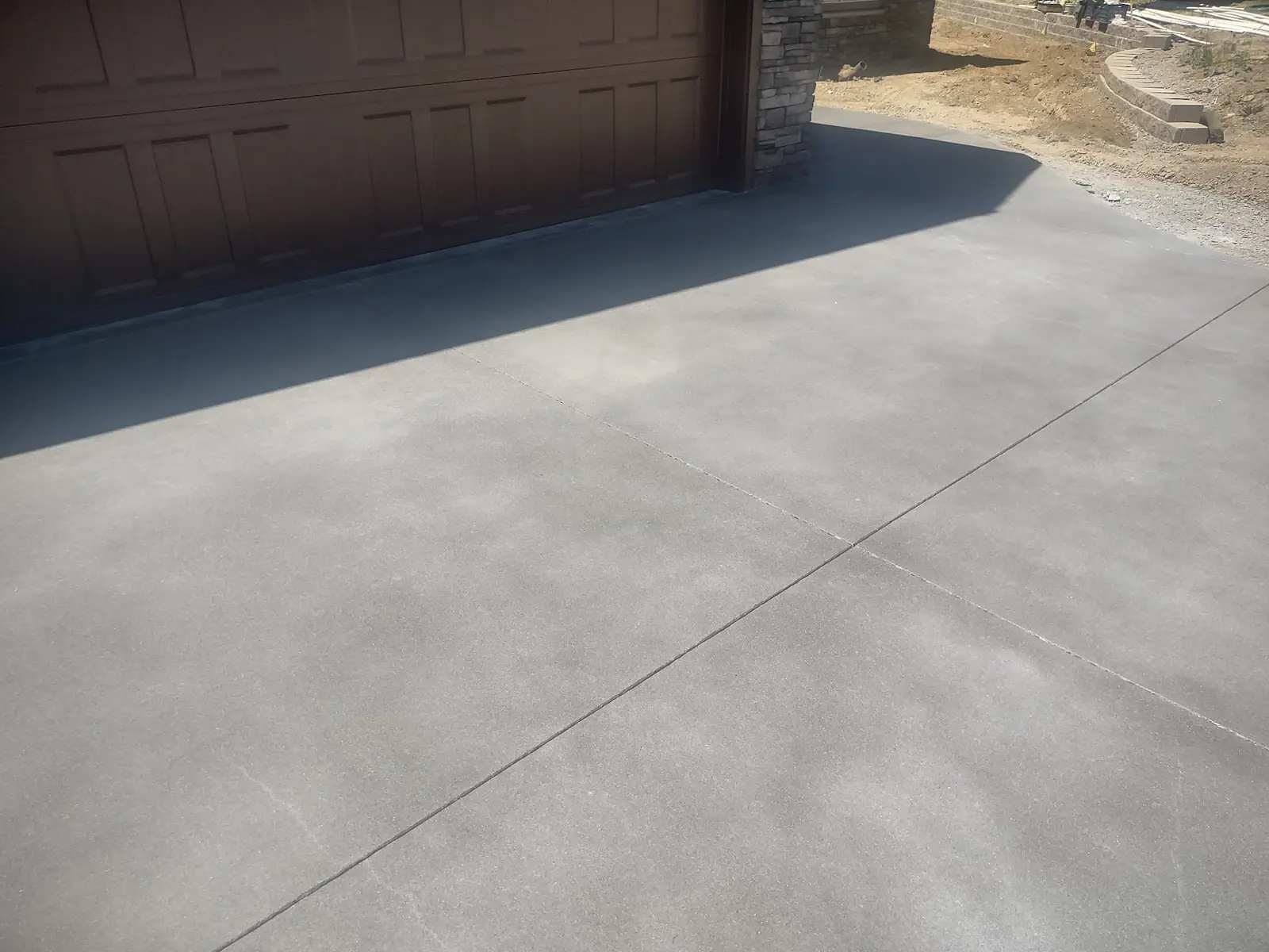 Sand-finish concrete driveway with saw-cut joints
