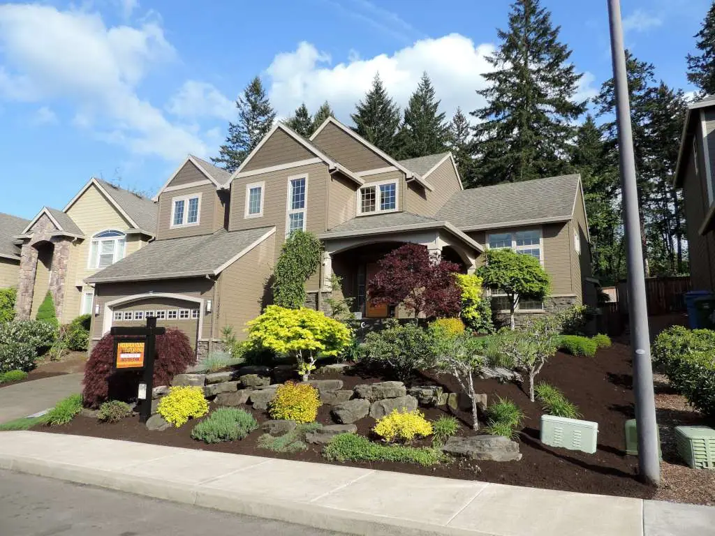 Two-story home with a landscaped front garden